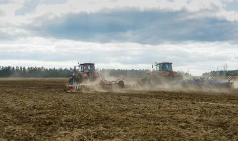 Machine plowing field Stock Photos
