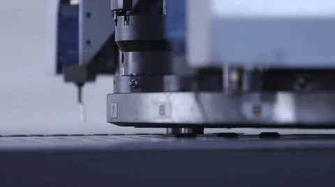 Machine pounding holes in sheet metal Stock Footage 63230103