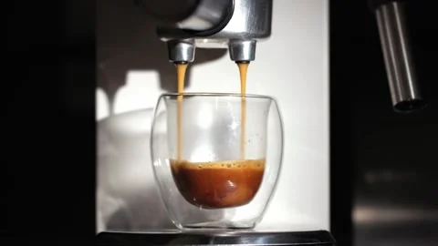 Machine pouring freshly brewed coffee 스톡 동영상 344642166