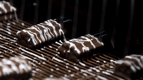 Machine pouring liquid on candies. Stock Footage 123863143