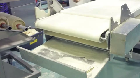 Machine preparing pastry at a commercial bakery Stock Footage 1086854