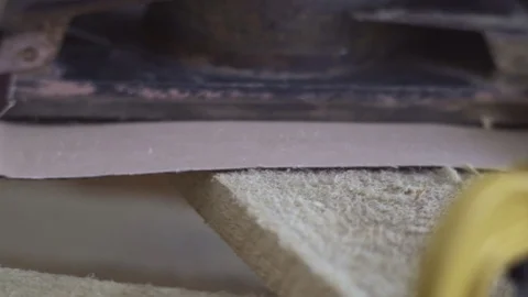 The machine for processing wood slides on a wooden beam, the machine is removed Stock Footage 94033103