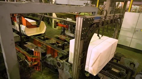 A machine for the production and packaging of cellulose sheets. Paper production Stockbeeldmateriaal 301829668