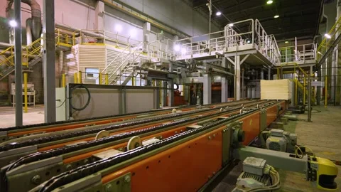 A machine for the production and packaging of cellulose sheets. Paper production Stockbeeldmateriaal 301953693