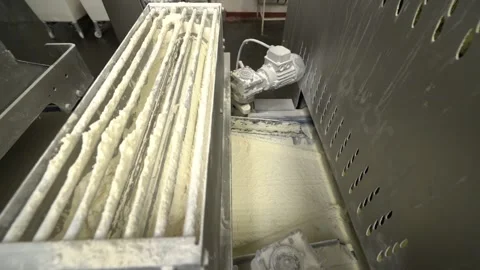 A machine for the production of bread baguettes on an industrial scale. Dough Stock Footage 170132921