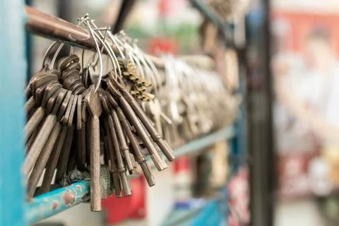 Machine production of duplicate metal keys for doors on the street of Bangkok. Stock Photos