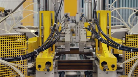 Machine in a production line assembling products Stock Footage