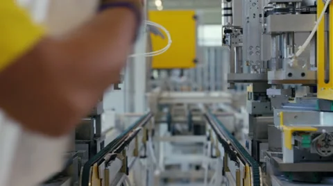 Machine in a production line assembling products Stock Footage 63018646