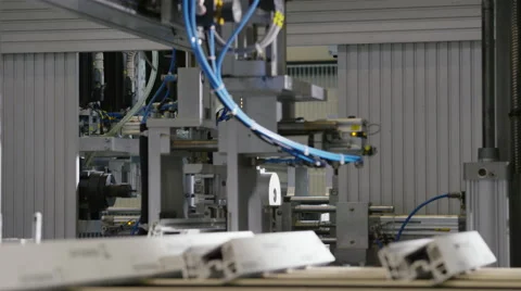 Machine in a production line assembling products Stock Footage 63019758
