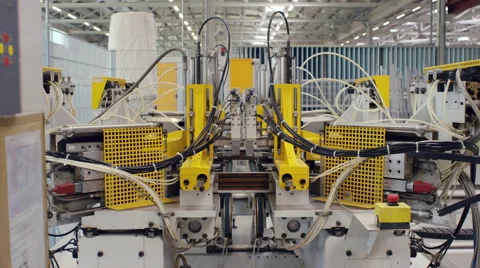 Machine in a production line assembling products Stock Footage 63028980