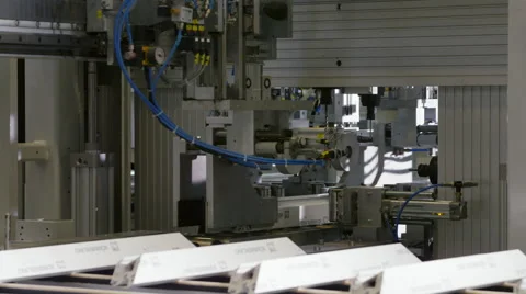 Machine in a production line assembling products Stock Footage 63032438