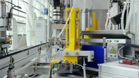 Machine in a production line assembling products Stock Footage 63032493