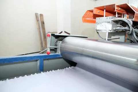 Machine for the production of powder paint. A layer of plastic is cut, crushe Stock Photos