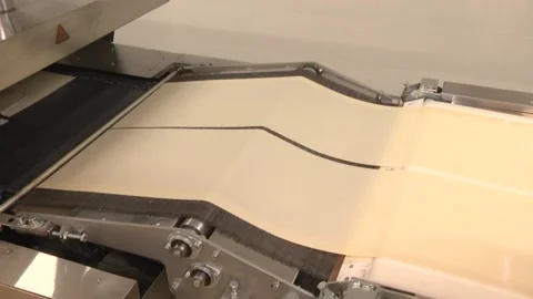 The machine for the production of thin dough Stock-Footage 105402567