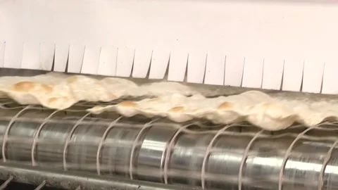 Machine for the production of thin dough. Pita Stock Footage 105402602