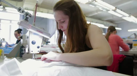 Machine pulling sewing tailor working with textile Stock Footage 62350820