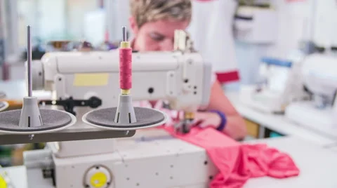 Machine pulling sewing thread while tailor working with textile Stock Footage 41017160