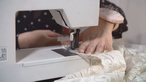Machine pulling sewing thread while tailor working with textile. Stock Footage 77401145