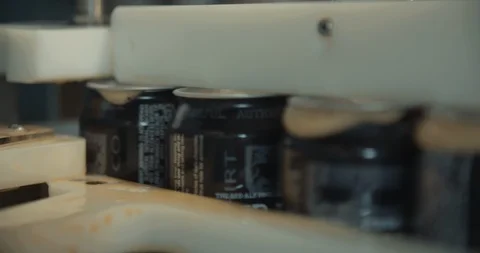 Machine Pushing Cans Through Assembly Line In Slow Motion 스톡 동영상 105340446