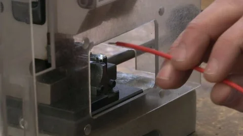 Machine puts contact metal part on a wire Stock Footage 72143976