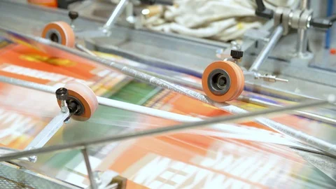 Machine Putting Plastic Wrapping Over Folders Stock Footage 129398955