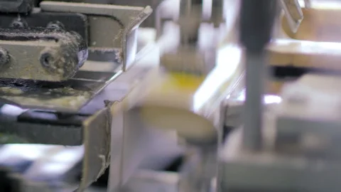 A machine is quickly packing soap Stock Footage 92375828