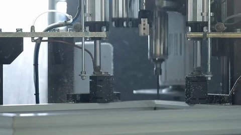 The machine removes excess plastic on the plastic window Stock Footage 76950974