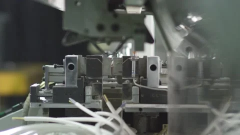 Machine removes the insulation from the wire and cuts it Video stock 162363276