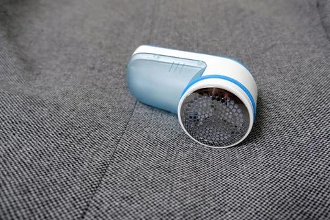 Machine for removing spools from clothes Stock Photos