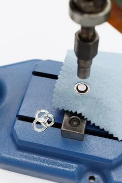 Machine for rivets and buttons in sewing production Foto stock