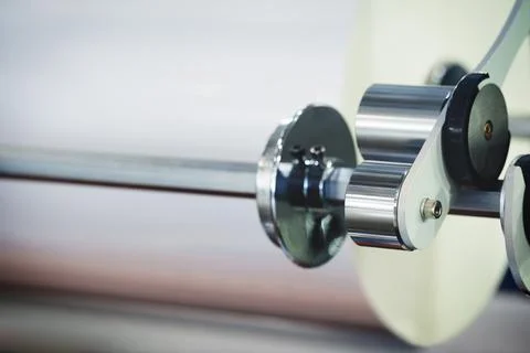 A machine with a roll of polyethylene plastic wrapping film on it. The machin Foto stock