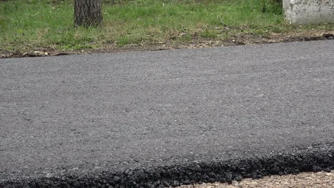Machine roller asphalt roller passes over freshly laid asphalt Video stock 126781506