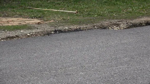 Machine roller asphalt roller passes over freshly laid asphalt Stock Footage 126782072