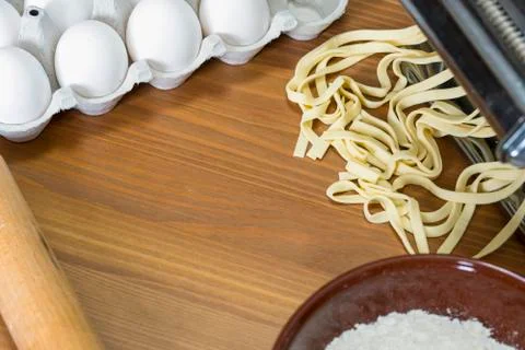 Machine for rolling dough and cutting Italian pasta, eggs and flour Stock Photos