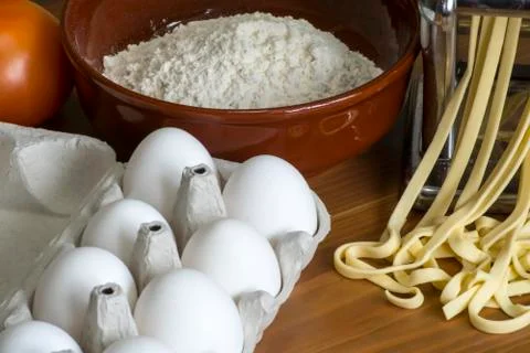 Machine for rolling dough and cutting Italian pasta, eggs and flour Stock Photos