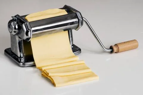 Machine for rolling dough and cutting Italian pasta noodles Stock Photos