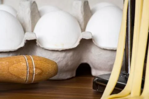 Machine for rolling dough and cutting Italian pasta, eggs and flour Stock Photos