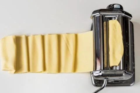 Machine for rolling dough and cutting Italian pasta noodles Stock Photos