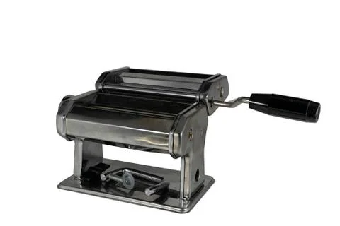 Machine for rolling out dough and cutting noodles. Stock Photos