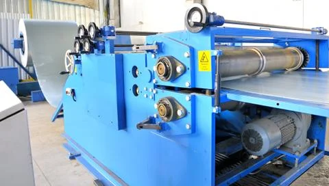 Machine for rolling steel sheet in warehouse Stock Photos