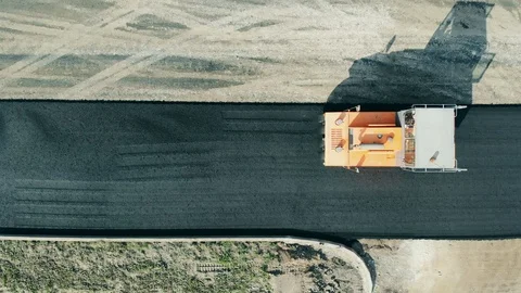 A machine rolls asphalt on a road. Stock Footage 119018830