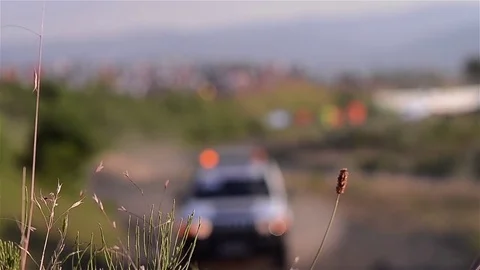 Machine with rotating beacons which is seen among green grass on the roadside Stock Footage 71755615