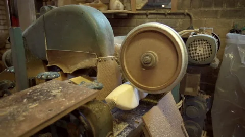 Machine is sanding the clogs from a wooden block. [Slomo] Stock Footage 47079335