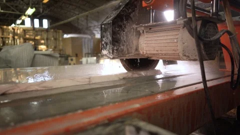 The Machine Saws White Marble. Slow Motion. Wide angle. Camera moves forward Video stock 127567612