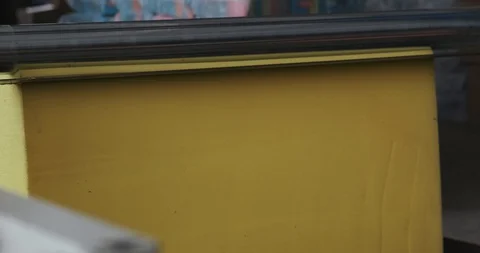 Machine with sharp knife cuts porolon into thin sheets of foam. Making furniture Stock Footage 128786747