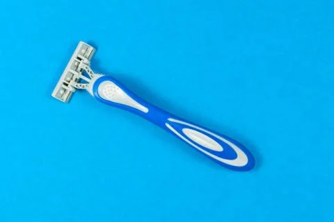 Machine of to shave, razor isolated on blue background Stock Photos