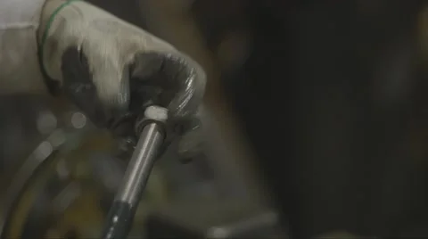 Machine Shop Worker Checking Threads CU of Hand and Nut Stock Footage 40936813
