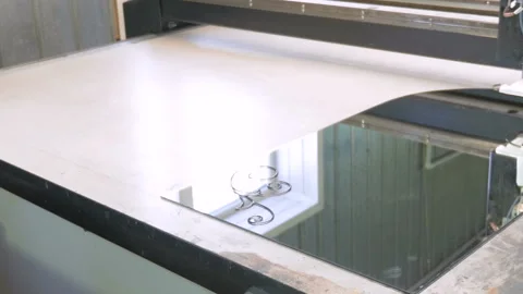 A machine with software control makes a drawing on the glass with the help of Video stock 85655874