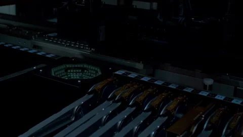 Machine sorting and assembling components for an electronic device. Stock Footage 337072575