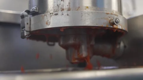 A machine is spitting out red sauce Video stock 297840663